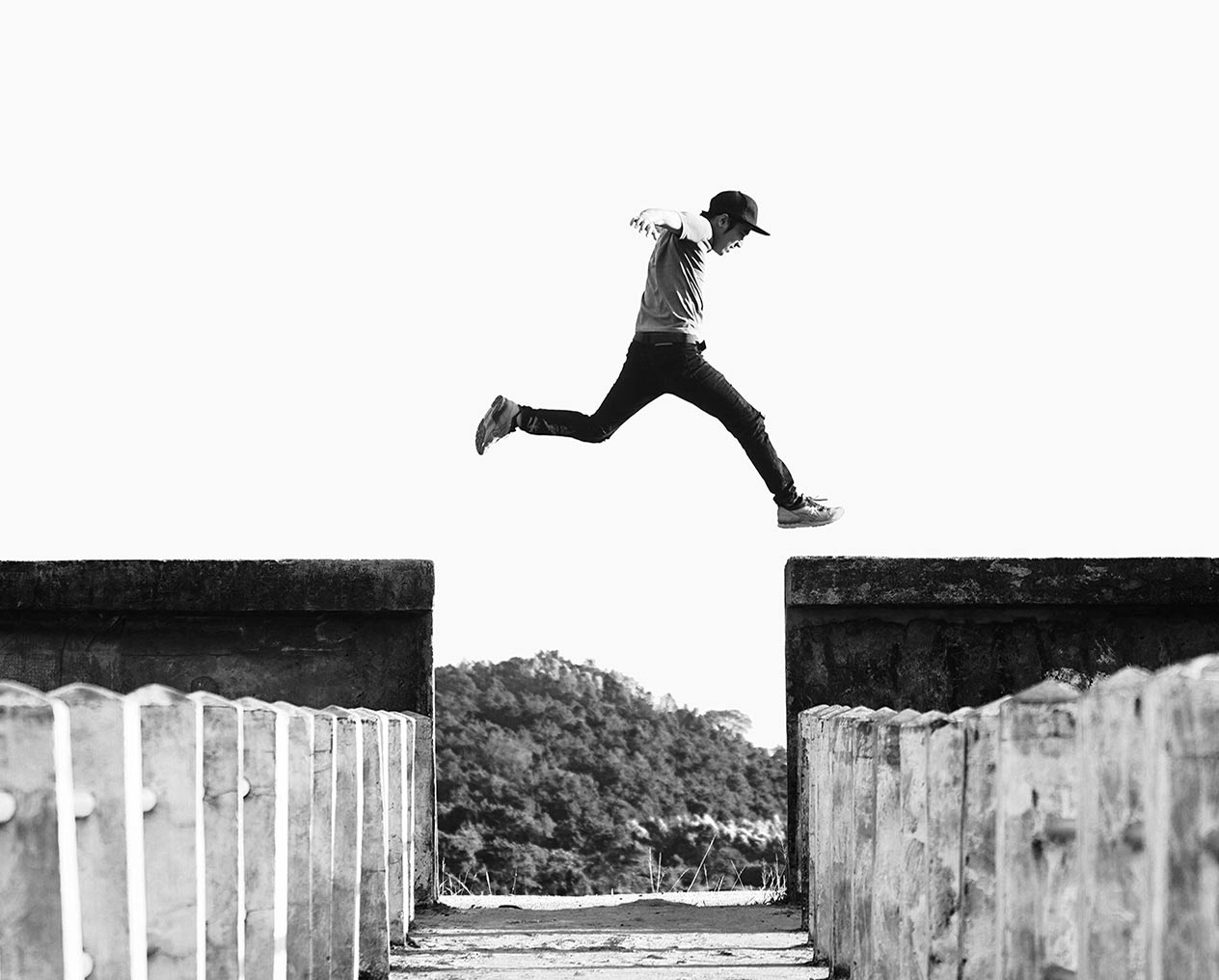 Person leaping across wall
