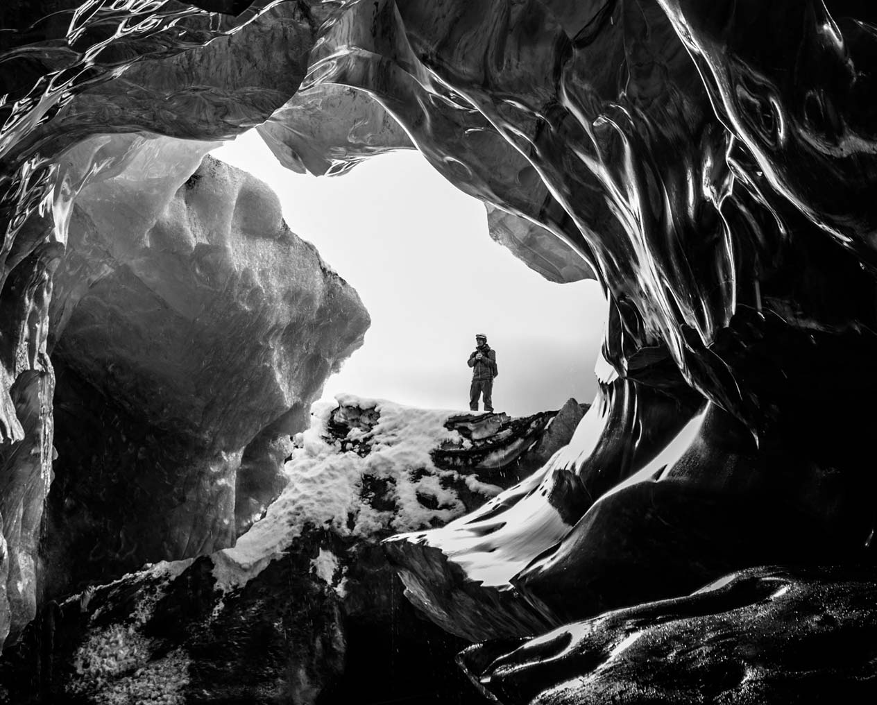 Man exploring ice cave