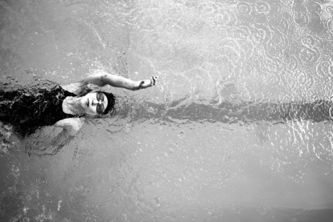 Woman swimming backwards