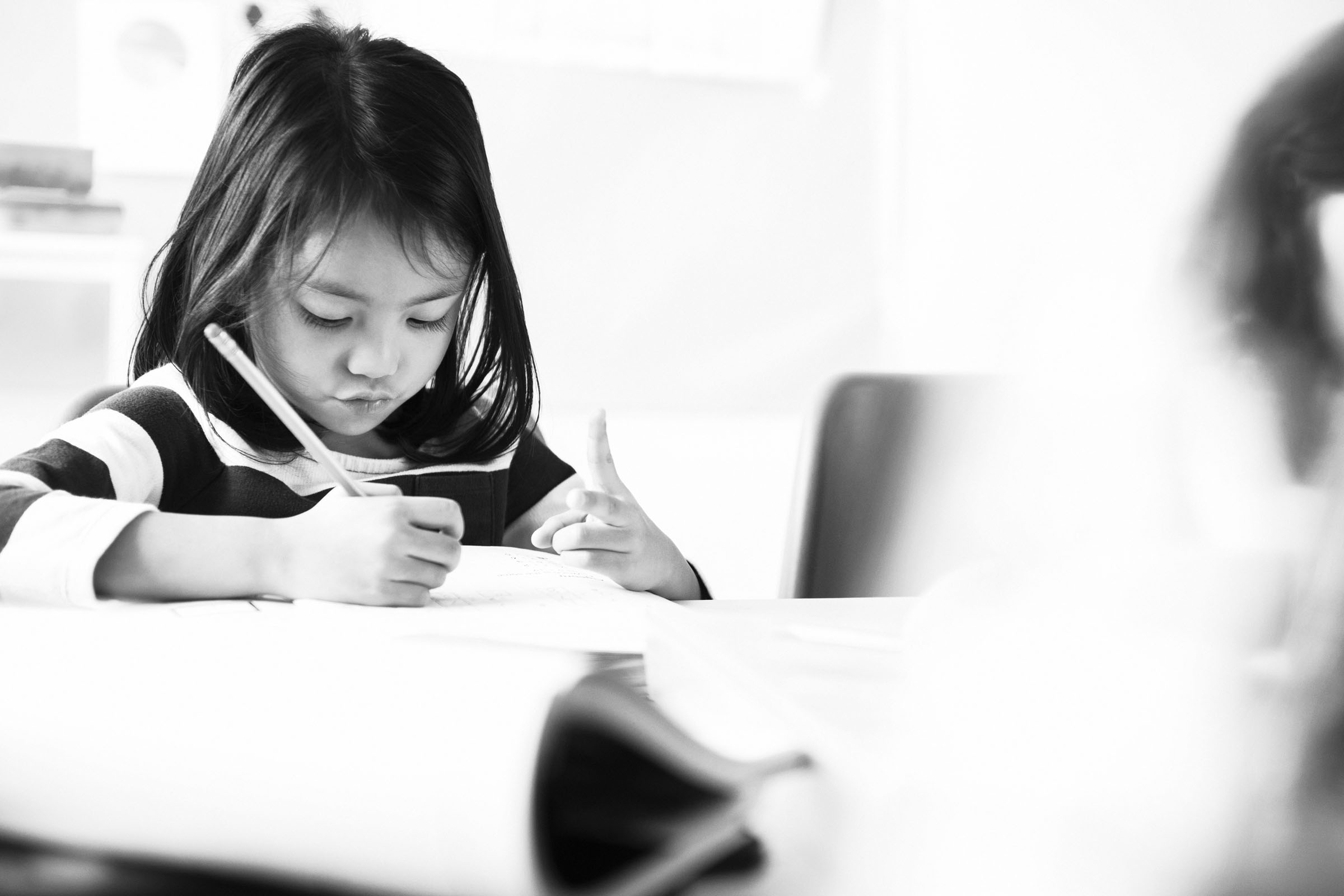 little girl writing
