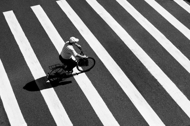 Man riding cycle on strips