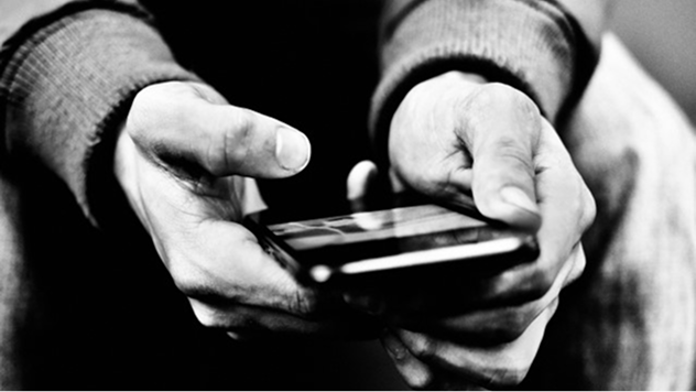 Image of a person using their smartphone