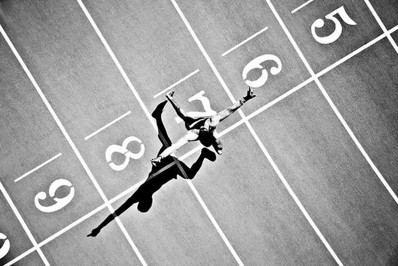 Image of a man running on a track.