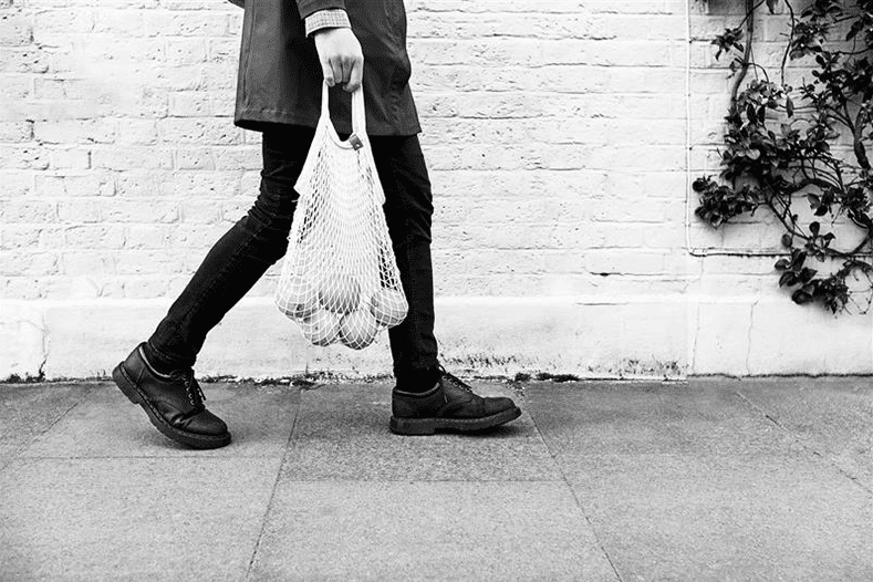 Image of woman holding a shopping bag.