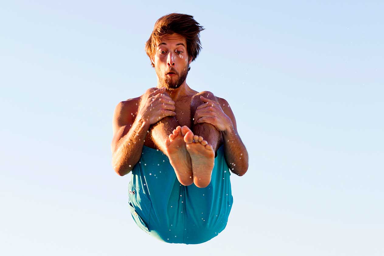 Man jumping over wall.