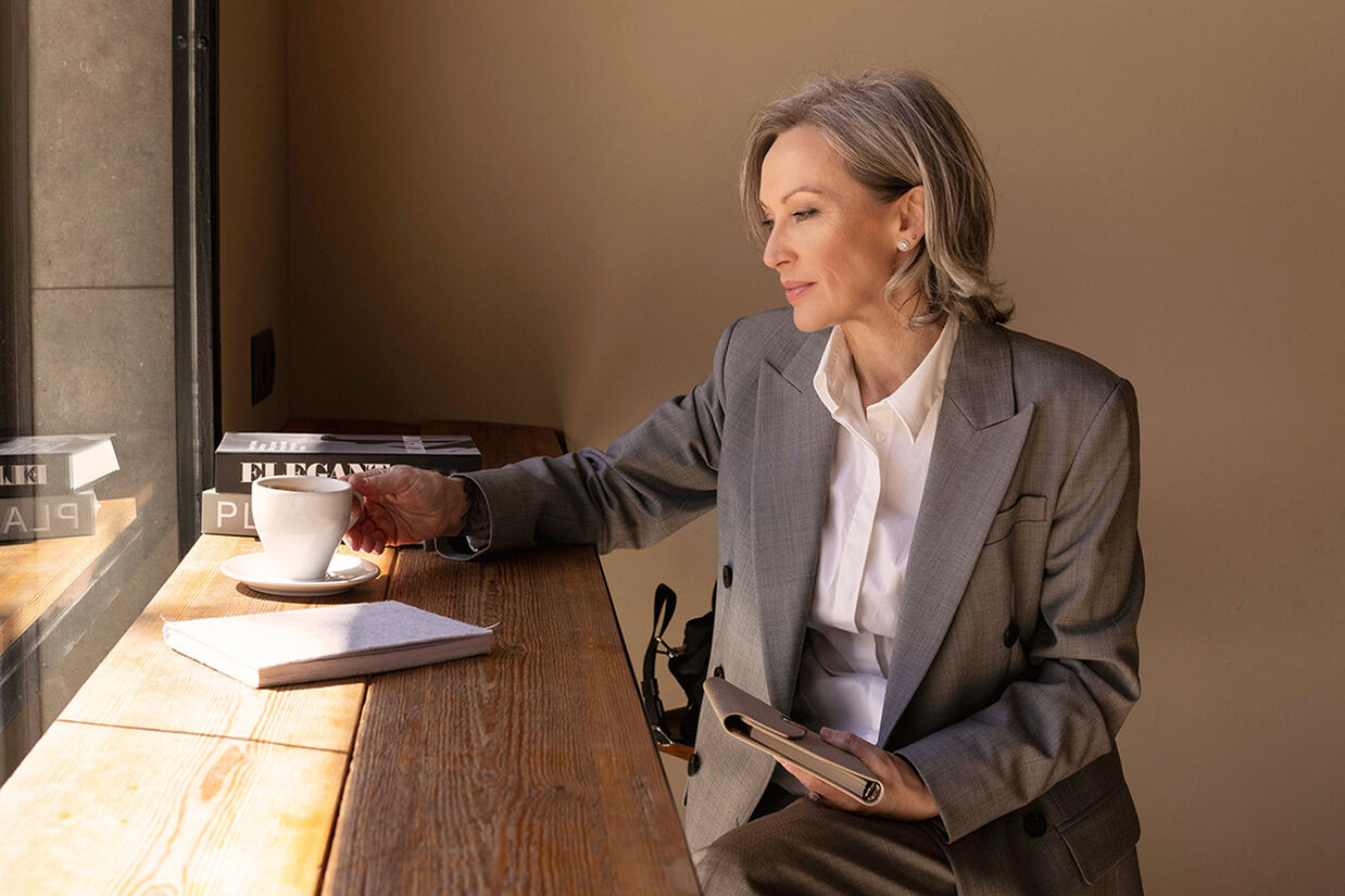 Woman sat at a desk.
