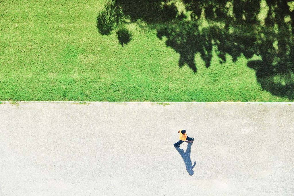 Aerial shot of people walking in public square
