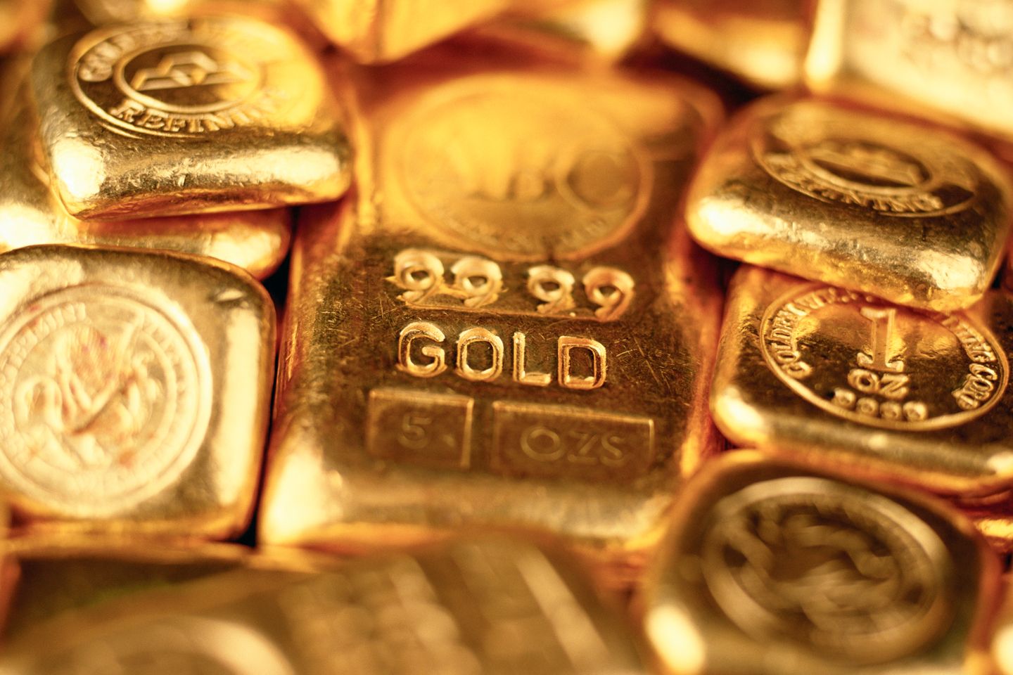 Several gold bars and coins.