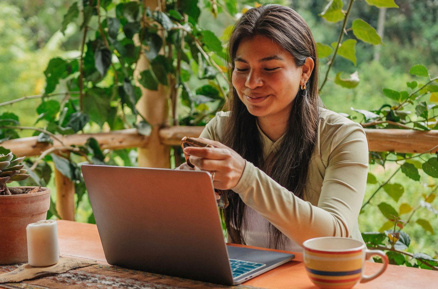 Woman looking at a laptop.